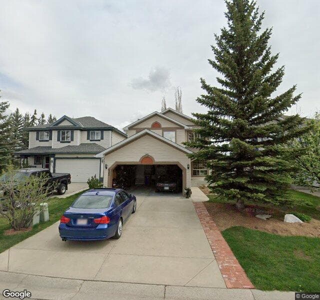 Street view of 432 Rocky Ridge Bay NW, Calgary
