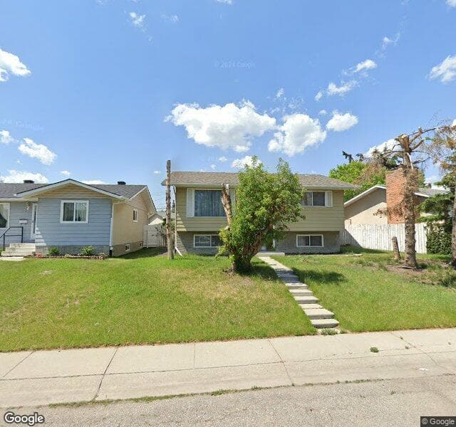 Street view of 919 Penmeadows Road SE, Calgary