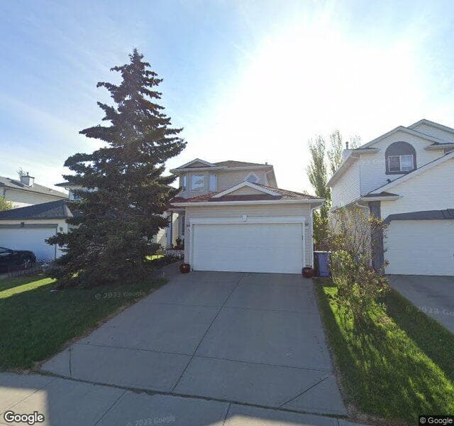 Street view of 84 Hidden Spring Close NW, Calgary