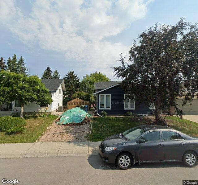 Street view of 64 Woodmont Drive SW, Calgary