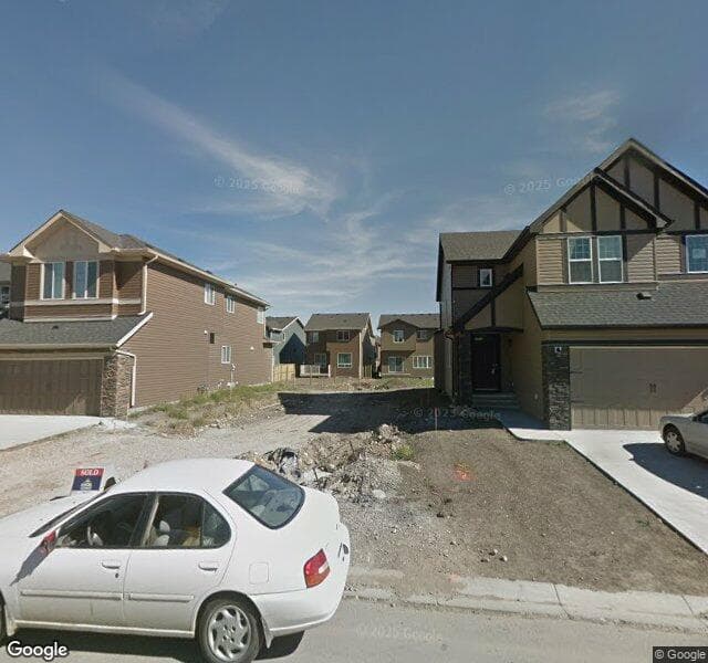 Street view of 125 Cougar Ridge Green SW, Calgary