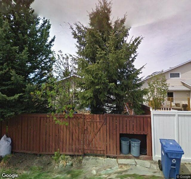 Street view of 72 Woodfern Way SW, Calgary