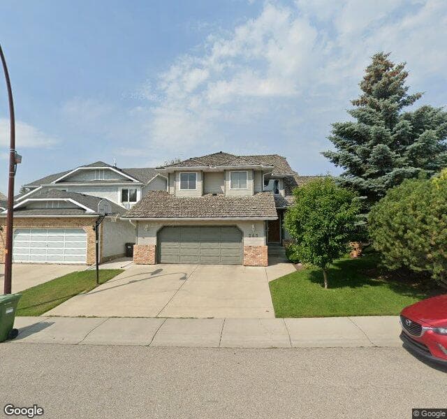 Street view of 245 Woodbriar Circle SW, Calgary