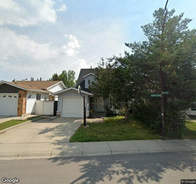Street view of 140 Woodmont Drive SW, Calgary