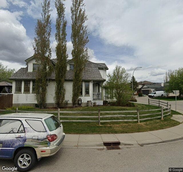 Street view of 585 Rocky Ridge Bay NW, Calgary