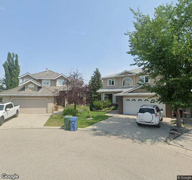 Street view of 216 Woodpark Bay SW, Calgary