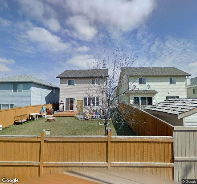 Street view of 718 Harvest Hills Drive NE, Calgary