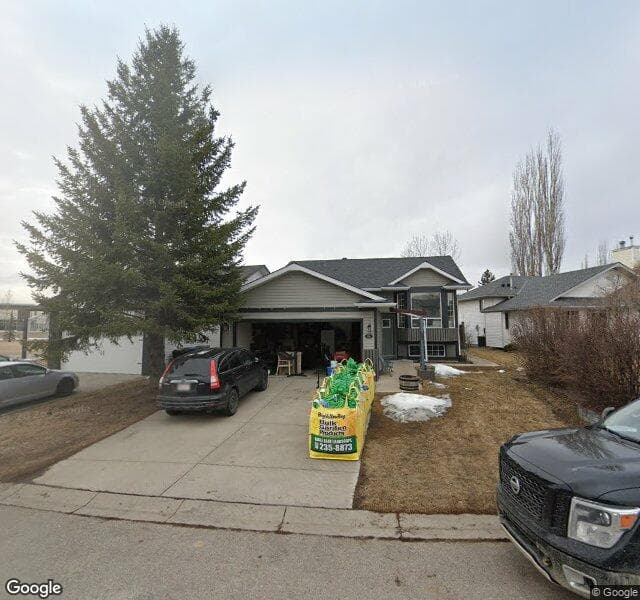 Street view of 210 Riverstone Cove SE, Calgary