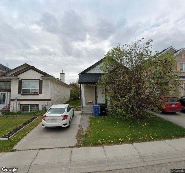 Street view of 1086 Bridlemeadows Manor SW, Calgary