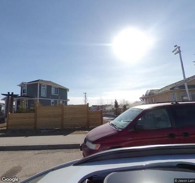 Street view of 1218 Harvest Hills Drive NE, Calgary