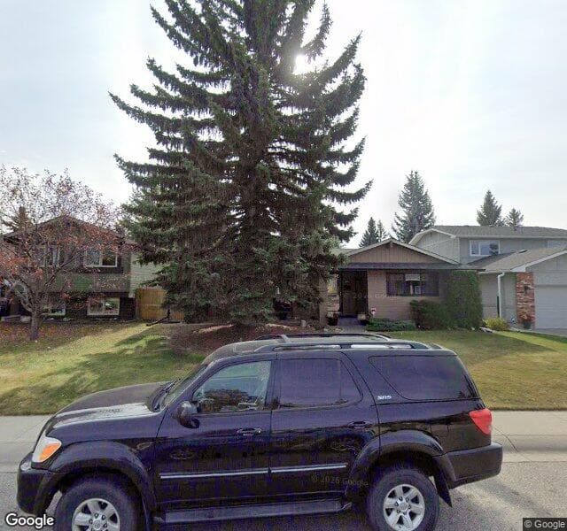 Street view of 215 Lake Lucerne Way SE, Calgary