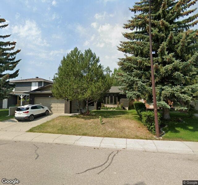 Street view of 47 Woodmont Way SW, Calgary