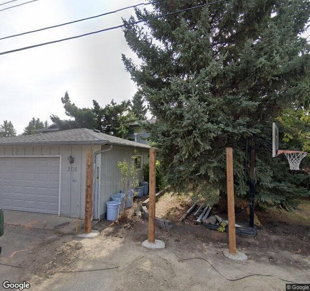 Street view of 208 Lake Lucerne Way SE, Calgary