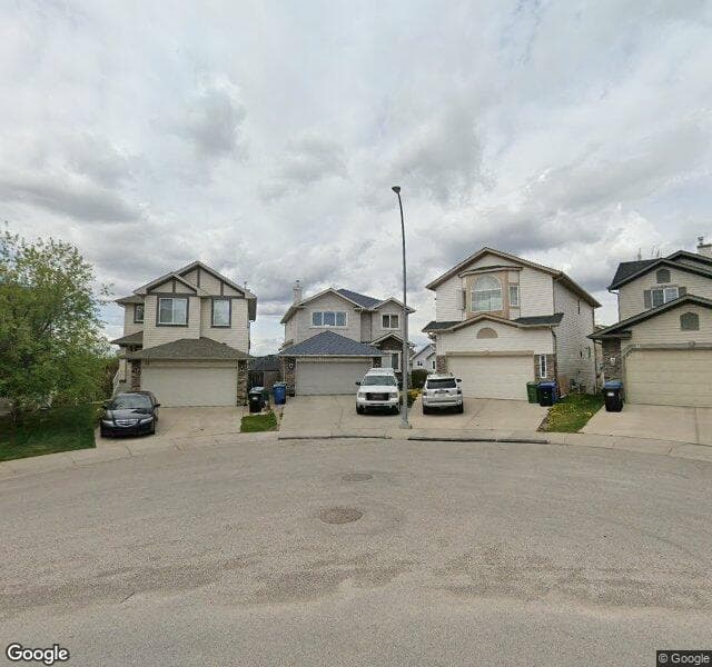Street view of 33 Rockbluff Place NW, Calgary