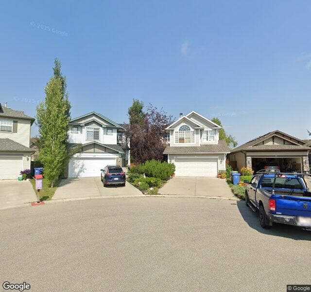 Street view of 24 Cougarstone Cove SW, Calgary