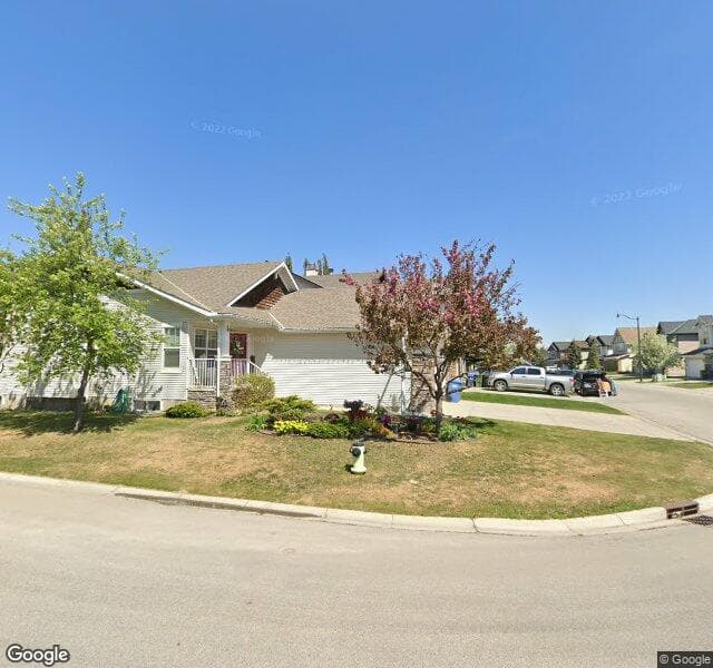 Street view of 47 Cougarstone Square SW, Calgary