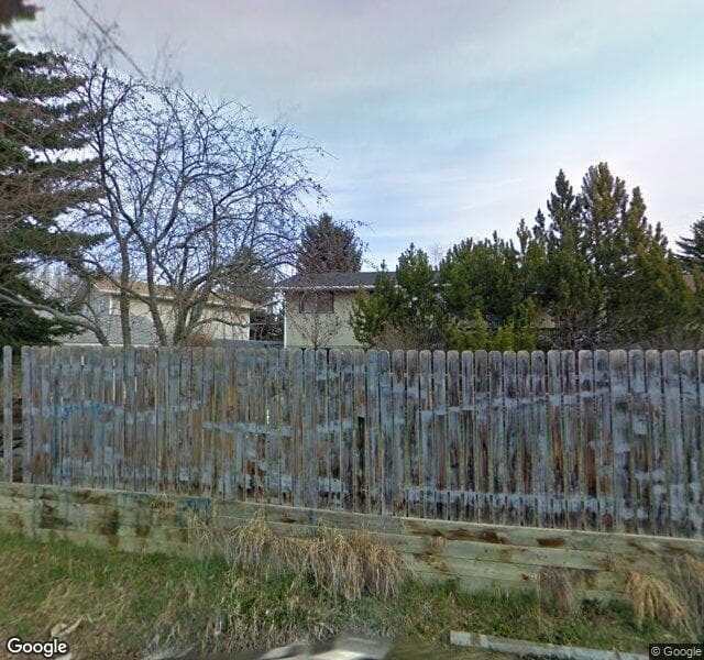 Street view of 7919 Huntwick Hill NE, Calgary