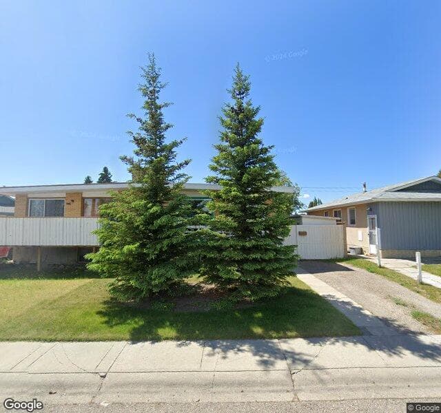 Street view of 102 Huntwick Way NE, Calgary