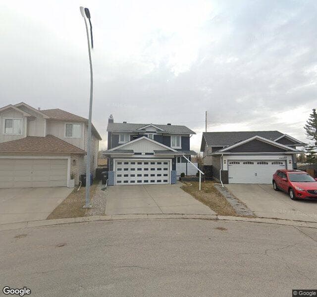 Street view of 59 Riverstone Close SE, Calgary