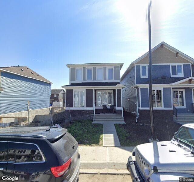 Street view of 82 Creekside Manor SW, Calgary