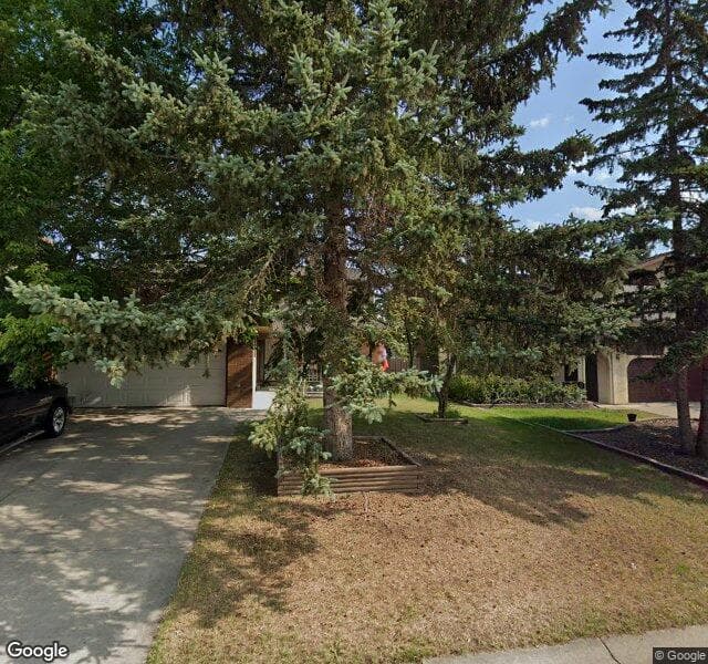 Street view of 64 Woodgrove Crescent SW, Calgary