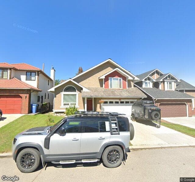 Street view of 124 Strathaven Circle SW, Calgary