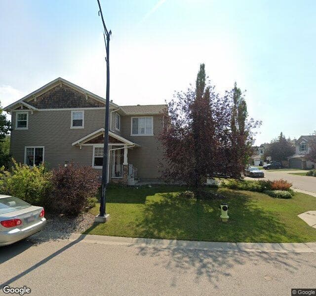 Street view of 68 Cougarstone Villas SW, Calgary