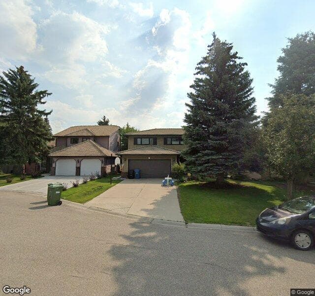Street view of 220 Woodhaven Place SW, Calgary