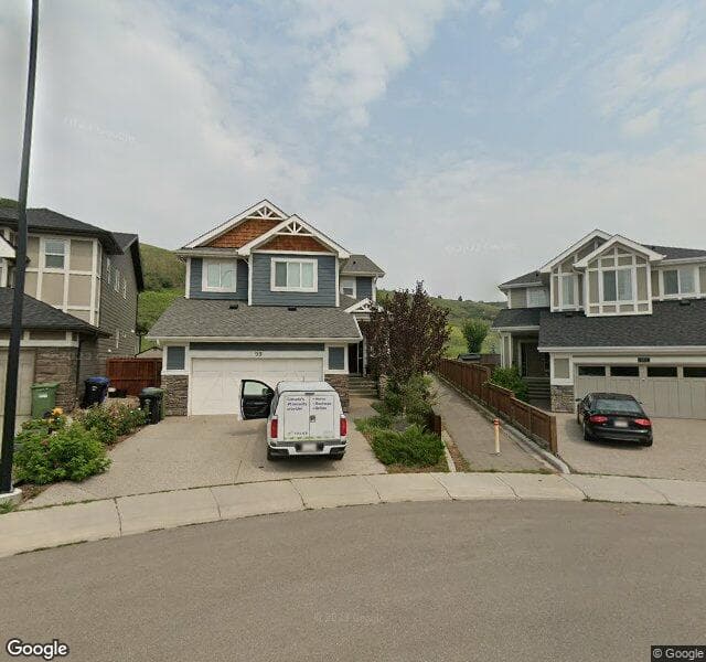 Street view of 99 Cranbrook Crescent SE, Calgary