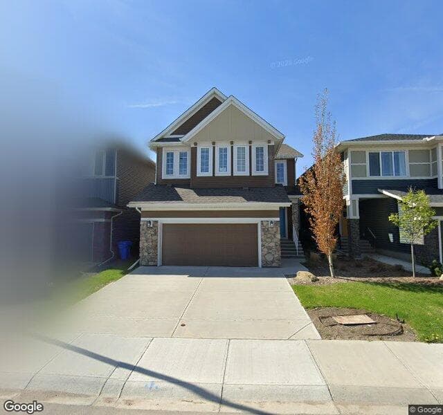 Street view of 57 Creekside Avenue SW, Calgary