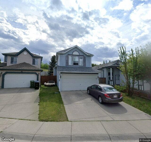 Street view of 228 Hidden Spring Green NW, Calgary