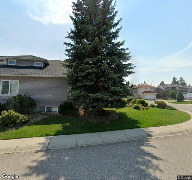 Street view of 119 Woodpark Circle SW, Calgary