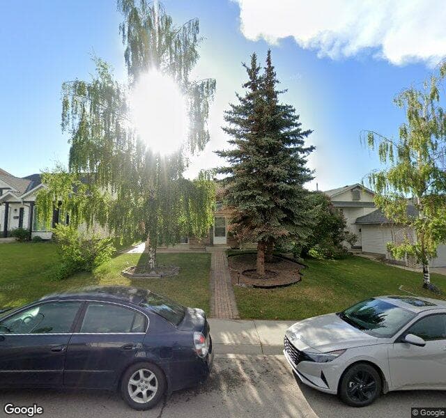 Street view of 947 Harvest Hills Drive NE, Calgary