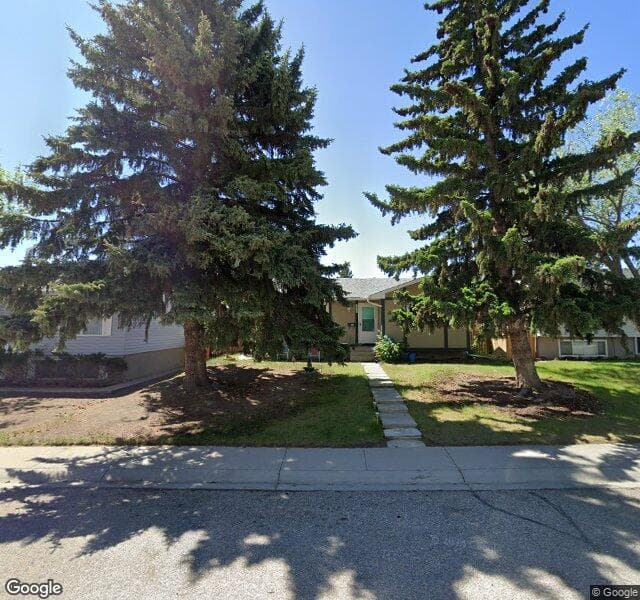 Street view of 7915 Huntwick Hill NE, Calgary