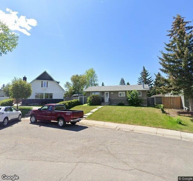 Street view of 119 Huntchester Crescent NE, Calgary