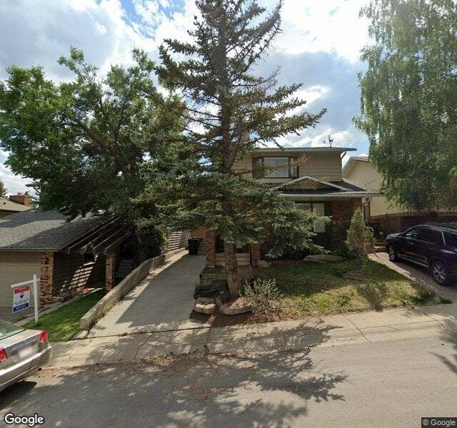 Street view of 11 Coach Manor Rise SW, Calgary