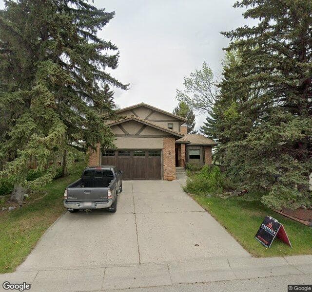 Street view of 64 Deerbrook Road SE, Calgary