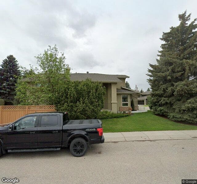Street view of 77 Sunset Close SE, Calgary