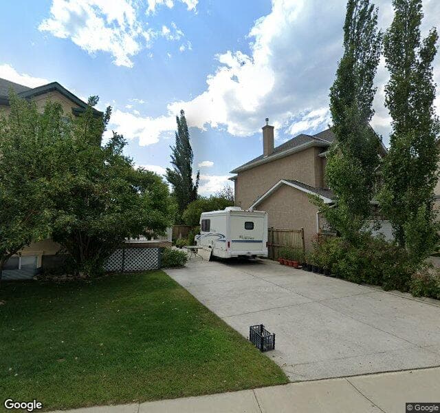 Street view of 94 Strathlea Crescent SW, Calgary