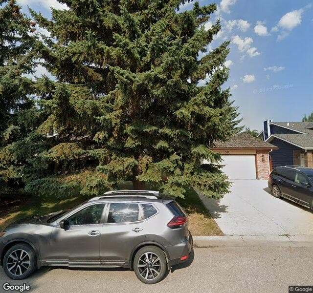 Street view of 59 Woodgreen Place SW, Calgary
