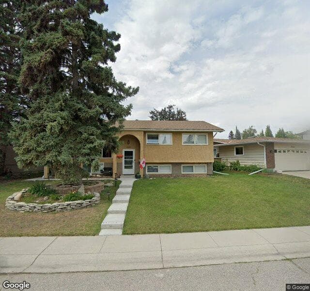 Street view of 1447 Lake Twintree Way SE, Calgary