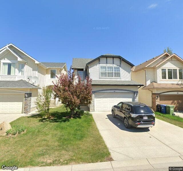 Street view of 90 Cougarstone Court SW, Calgary