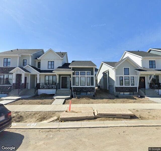 Street view of 1042 Creekside Boulevard SW, Calgary