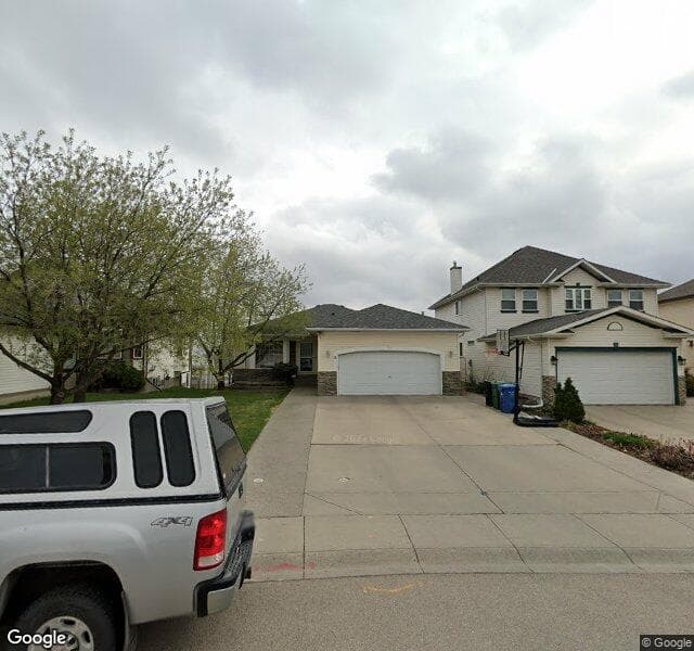 Street view of 18 Hidden Ridge View NW, Calgary
