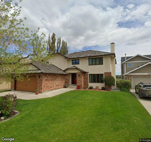 Street view of 232 Deer River Place SE, Calgary