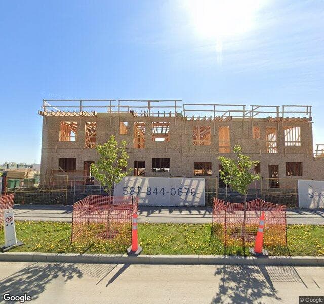 Street view of 52 Creekside Drive SW, Calgary