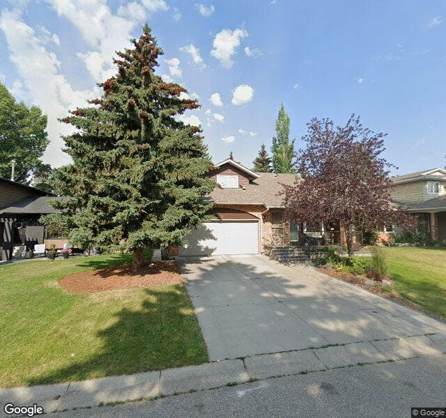 Street view of 72 Woodcroft Place SW, Calgary