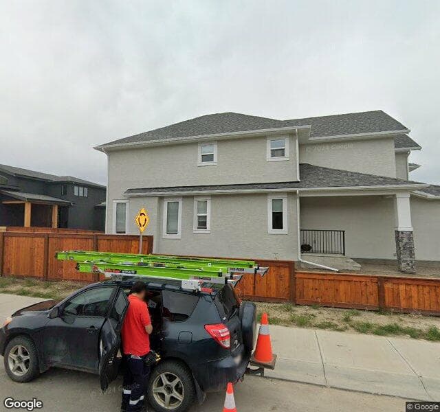Street view of 153 Cranbrook Grove SE, Calgary
