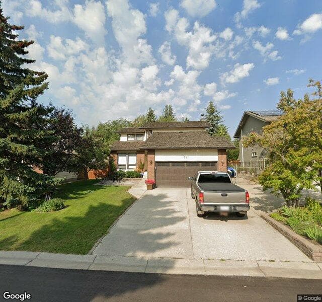 Street view of 48 Woodgate Close SW, Calgary