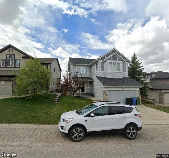 Street view of 21 Rockyspring Way NW, Calgary